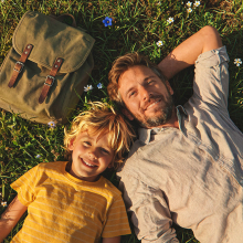 Father & son on meadow